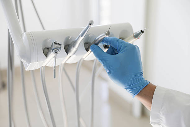 Professional Tooth Extraction technician working in Paris, KY